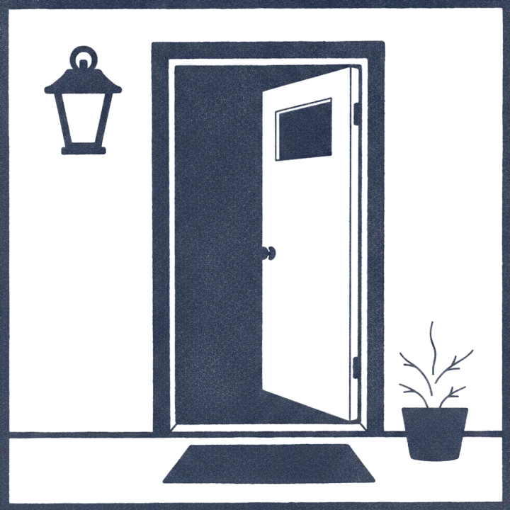 A porch lantern beside a front door left open